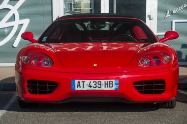 Lutterbach - France - 4 September 2022 - Front view of red ferrari F360 modena parked in the street