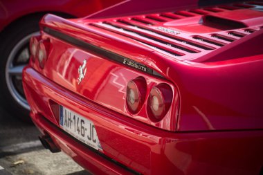 Lutterbach - France - 4 September 2022 - Rear view of red ferrari F355 GTS parked in the street