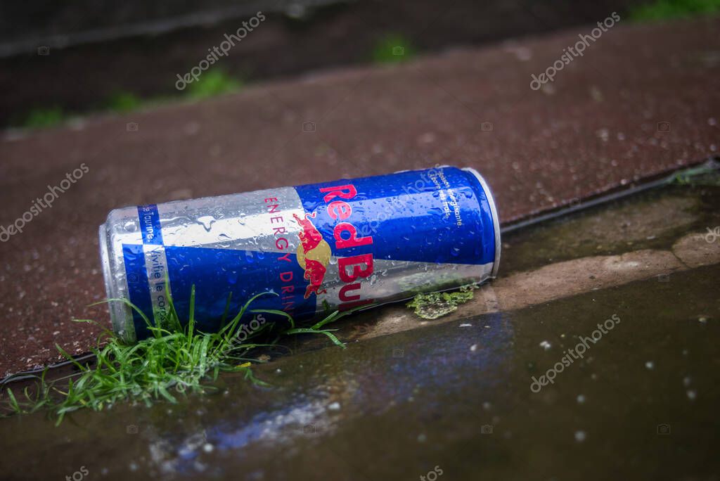 Mulhouse - France - 20 October 2022 - Closeup of empty red bull can abandoned in the street