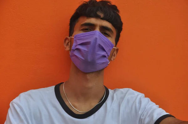 Close Indian Young Guy Wearing Face Mask Looking Camera Sitting — Zdjęcie stockowe