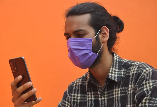 Closeup Young Indian Guy Hair Bun Wearing Face Mask Using — Stok fotoğraf