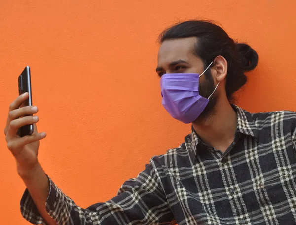 Close Young Indian Guy Hair Bun Wearing Face Mask Taking — Stok fotoğraf
