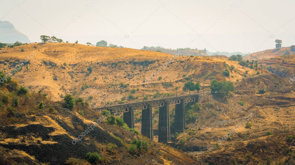 Classic bridge of Indian Railway surrounded by mountains