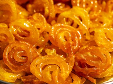 Ramadan or Ramazan food feast background or Iftar party concept - Yellow Jalebi