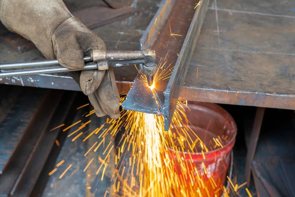 H-beam steel cutting with Hand Gas Cutting Torches, at the industrial factory.