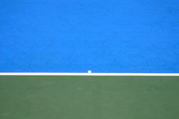 Tennisbaan, oppervlakte achtergrond blauw en groen — Stockfoto