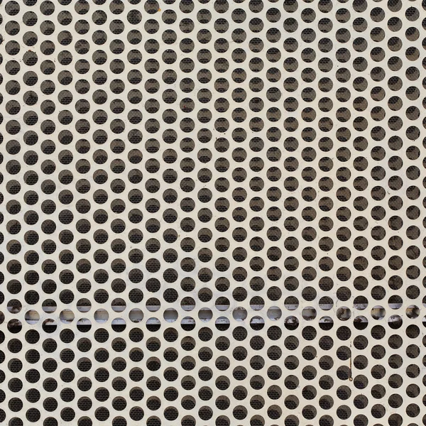 Hintergrund aus weißem Stahlmetall mit kreisförmigen Löchern — Stockfoto