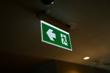 exit symbol for warning people, green light