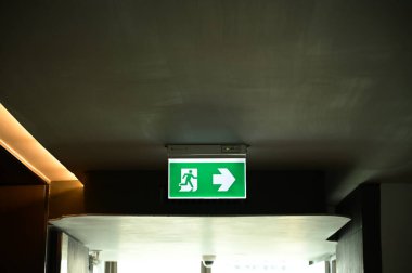 exit symbol for warning people, green light