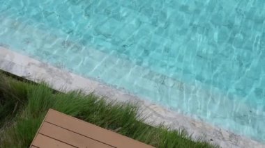 slow motion, clear water ripple surface in blue swimming pool