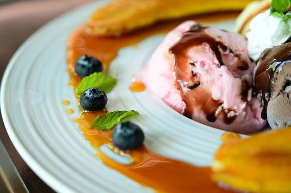 ice cream and fruit on plate