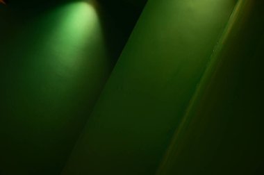 dark green wall and warm electric light, interior design
