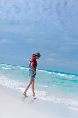 Beautiful young woman walking on the beach Varadero , Cuba