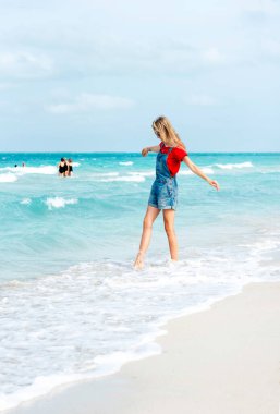 Beautiful young woman walking on the beach Varadero , Cuba