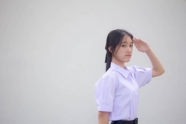 Asya Taylandlı lise öğrencisi üniforması. Güzel kız selamı.