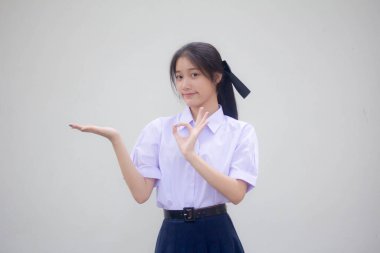 Asya Thai Lisesi öğrenci üniforması Güzel kız elini göster