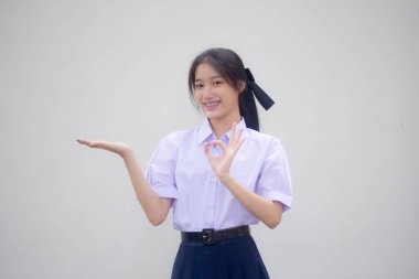 Asya Thai Lisesi öğrenci üniforması Güzel kız elini göster