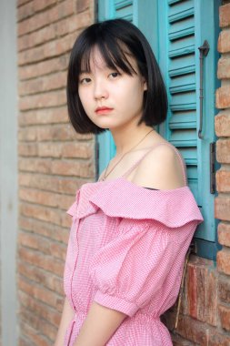 Asia Thai Teen Pembe tişört Güzel kız gülümse ve rahatla