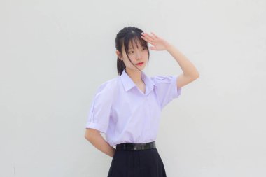 Asya Taylandlı lise öğrencisi üniforması. Güzel kız selamı.