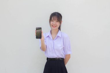 asia thai high school student uniform beautiful girl show her phone and smile