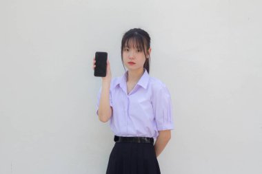 asia thai high school student uniform beautiful girl show her phone and smile