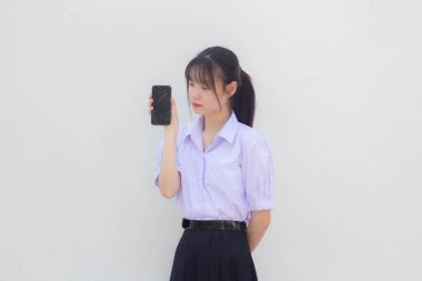 asia thai high school student uniform beautiful girl show her phone and smile