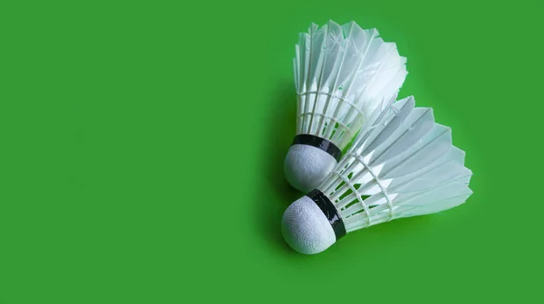 Badminton shutter cocks on on green background
