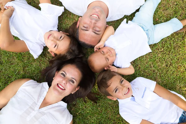 Portrait Family Five Father Mother Children Lying Fresh Grass Looking Royalty Free Stock Images