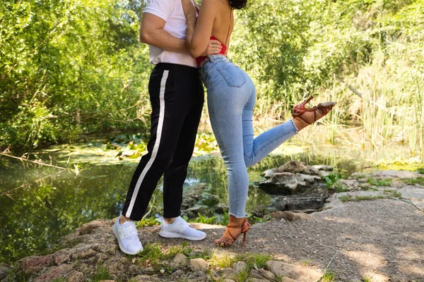 Young couple of Latin dancers, handsome and in love are walking in the park while showing their love. Woman and man are happy, in love and love each other. Love concept.