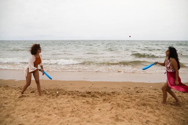 Two Young Beautiful Latin Women Play Tennis Beach Blue Paddles — Photo