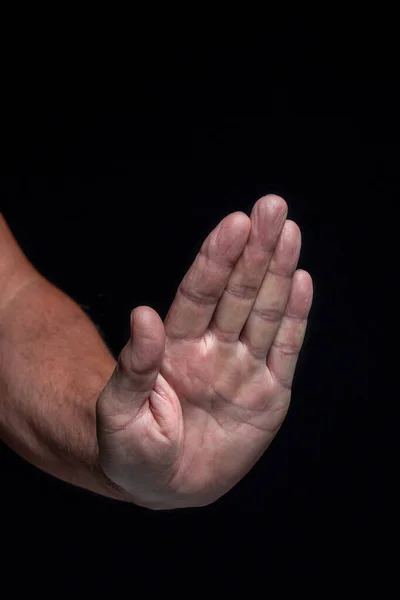 Uitgestrekte Linkerhandpalm Naar Voren Een Zwarte Achtergrond — Stockfoto