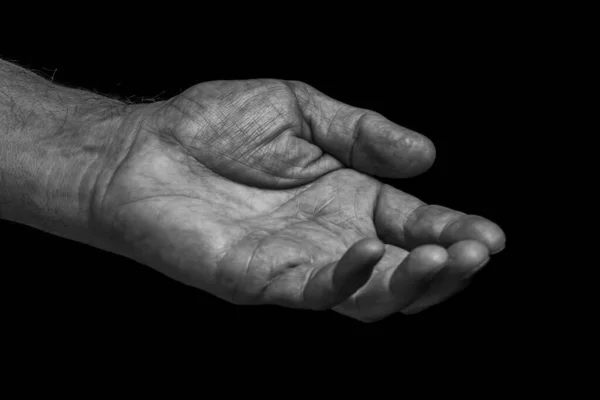 Closeup Wrinkled Left Hand Elderly Man Asks Help Black Background — Stock Photo, Image