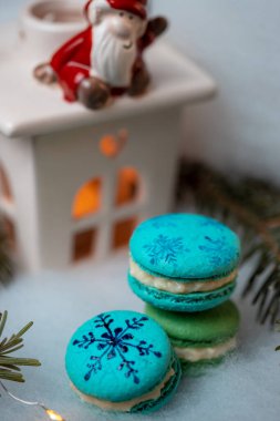 Christmas macarons on a cozy and warm background. Christmas time.
