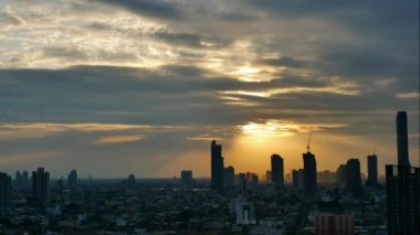 Time lapse of the sunset scene of Bangkok skyline and skyscraper in Bangkok city downtown at the rooftop of Hotel, Chan Road Sathorn, Bangkok, Thailand.