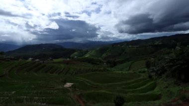 Time Lapse of Colorful dramatic sky on the beautiful terraced green rice fields at Ban pa pong piang rice terraces of Chiang Mai, Thailand