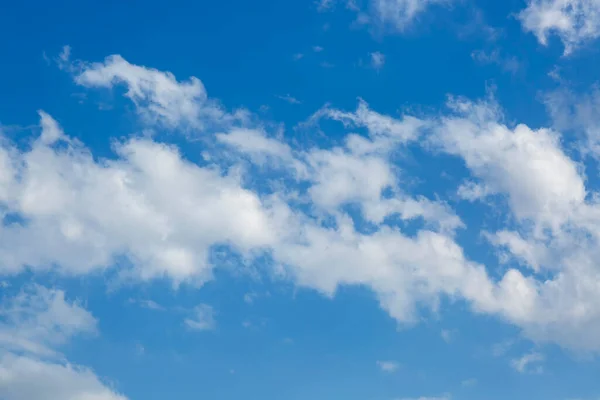 Wallpapers of the blue Sky and white cloud during day. Beautiful clear cloudy in sunlight calm season. Cloudy sunny sky in morning. Heaven background with big clouds with soft light from the sun.