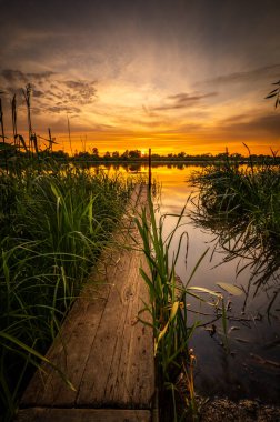 colorful and delightful sunset over the bug river.
