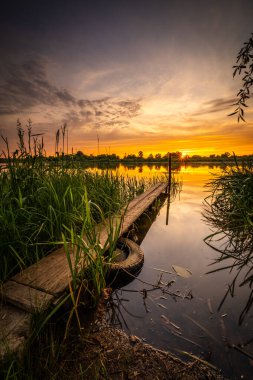 colorful and delightful sunset over the bug river.
