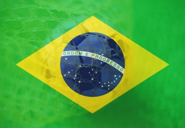 Brezilya bayrağı ile futbol topu arka plan, spor ve başarı iş konsepti olarak kalede.