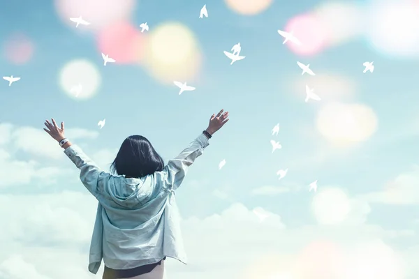 Woman Raise Hands Blue Sky Birds Flying Colorful Bokeh Light — Stock Photo, Image