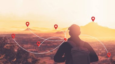 Backpacker man standing at top of mountain looking view landscape with navigator gps location abstract background. Copy space travel adventure holiday and technology business concept. Vintage color.