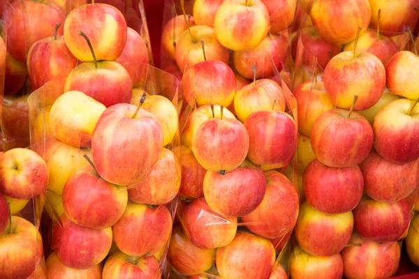 apple in plastic bag for sale at a market