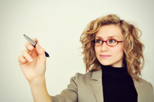 Businesswoman drawing graph with pen — Stock Photo, Image
