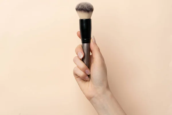 Close Image Woman Hand Makeup Brush Isolated Beige Background — Stock Photo, Image