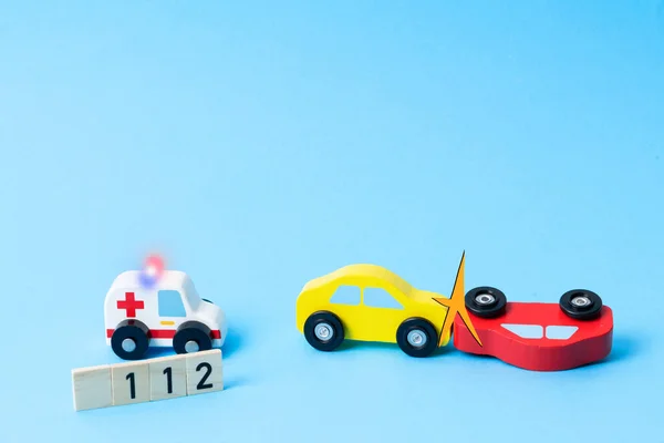 Two mini toy car crash with ambulance and police car. Toy car