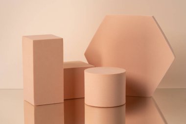 Geometric composition of aesthetic beige figures exposed on the beige background. Background for cosmetic presentation.