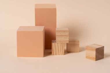 Geometric composition of aesthetic beige figures exposed on the beige background. Background for cosmetic presentation.