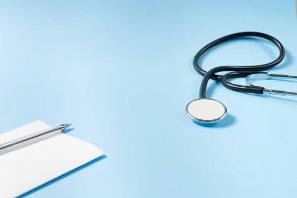 Close View Black Stethoscope Prescription Pad Blue Background — Fotografia de Stock