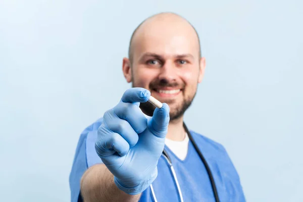 Young Happy Doctor Blue Medical Scrubs Stethoskope Overneck Showing Pill — Fotografia de Stock