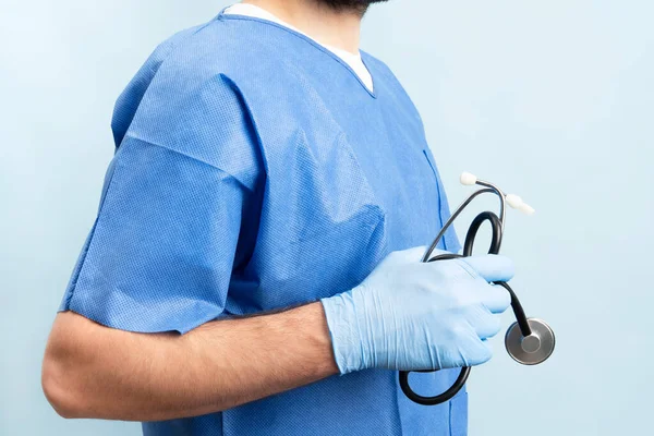 Young Male Doctor Blue Medical Scrubs Nitrile Gloves Holding His — Fotografia de Stock